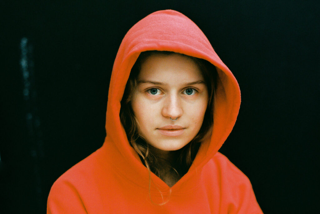 Serotonin on a stage girl in red plays secret show in Berlin Picky
